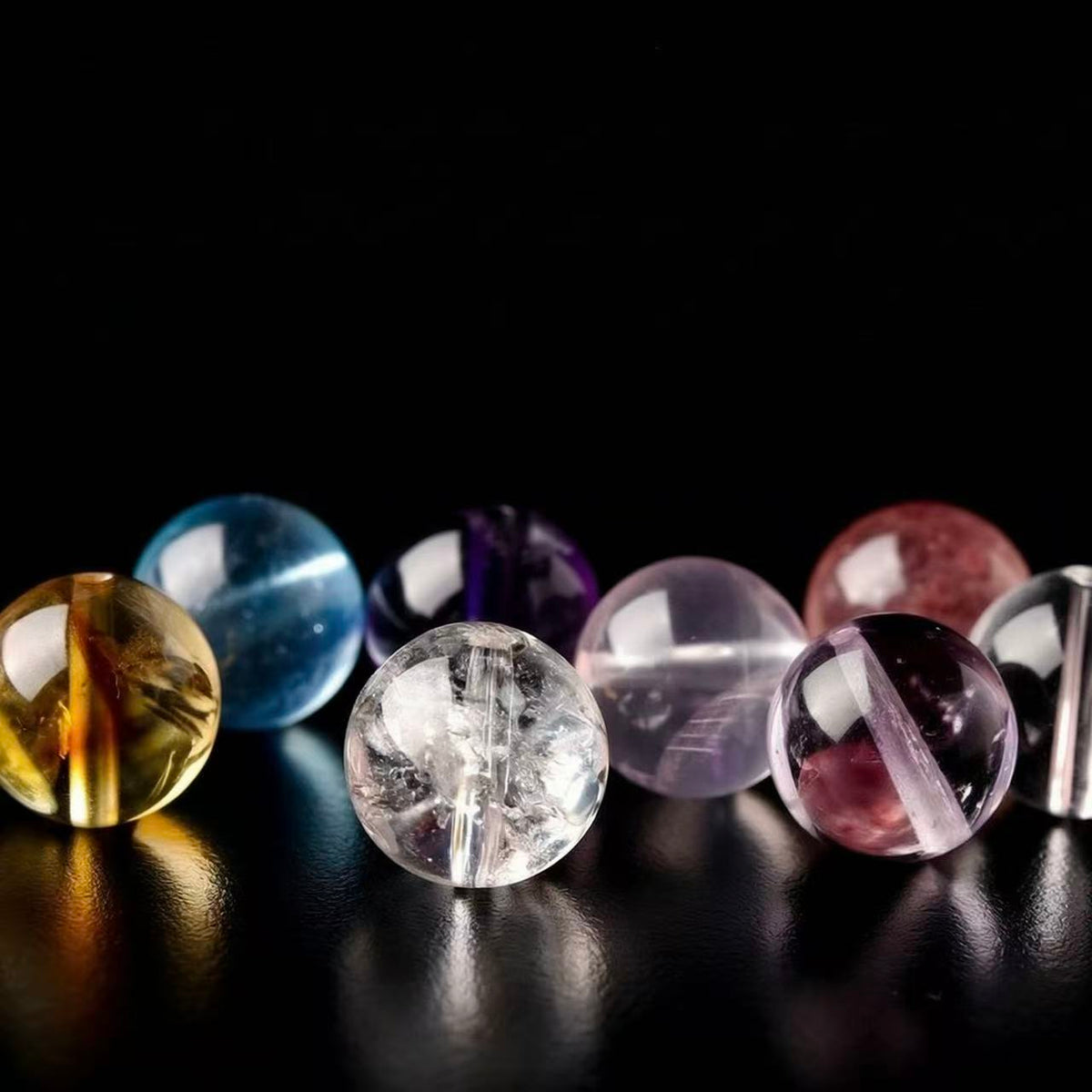 A full range of crystals, including clear quartz, amethyst, and Nanhong agate.