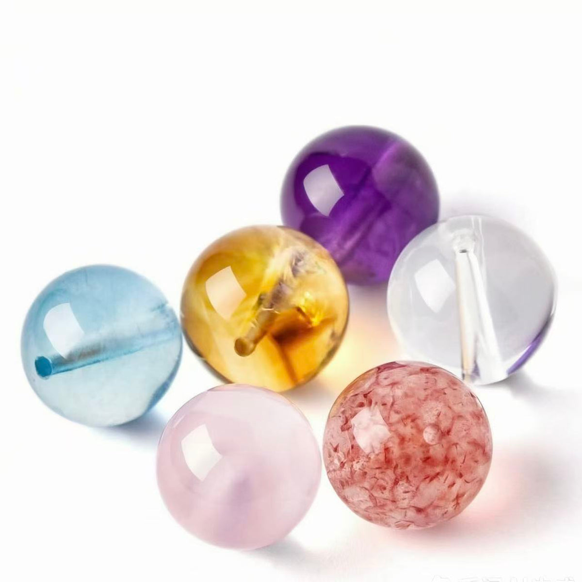 A full range of crystals, including clear quartz, amethyst, and Nanhong agate.